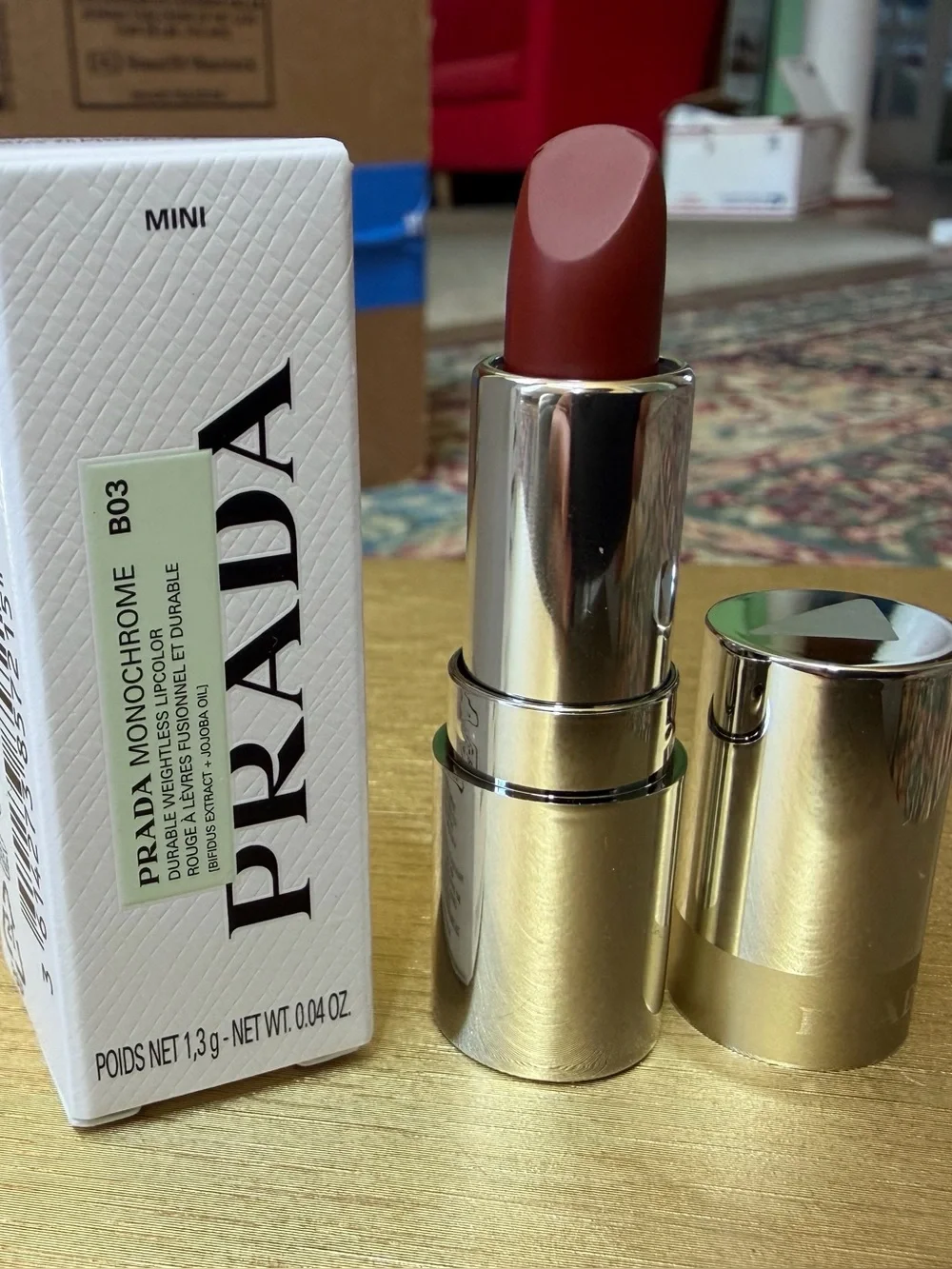 Prada Monochrome Hyper Matte lipstick in B03 Mahogany. MINI size. 0.04oz